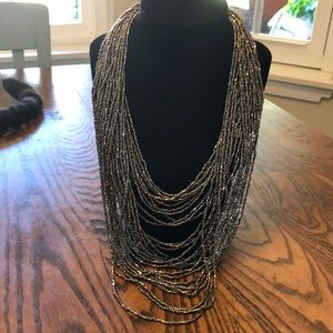 Strands of dark silver tone beads necklace.